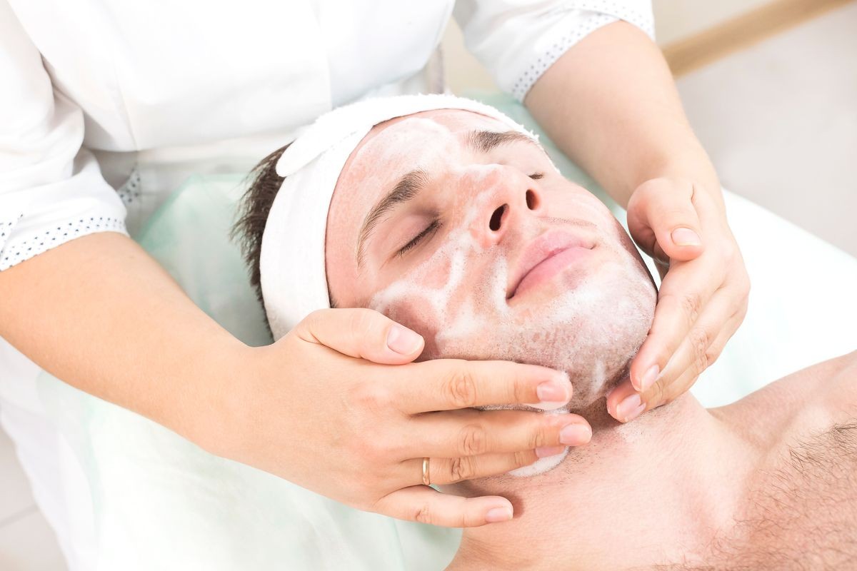 Man in the mask cosmetic procedure in spa salon 